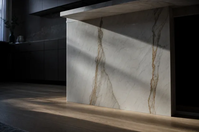 Low angle of a marble island with a waterfall edge in a bright Perth kitchen